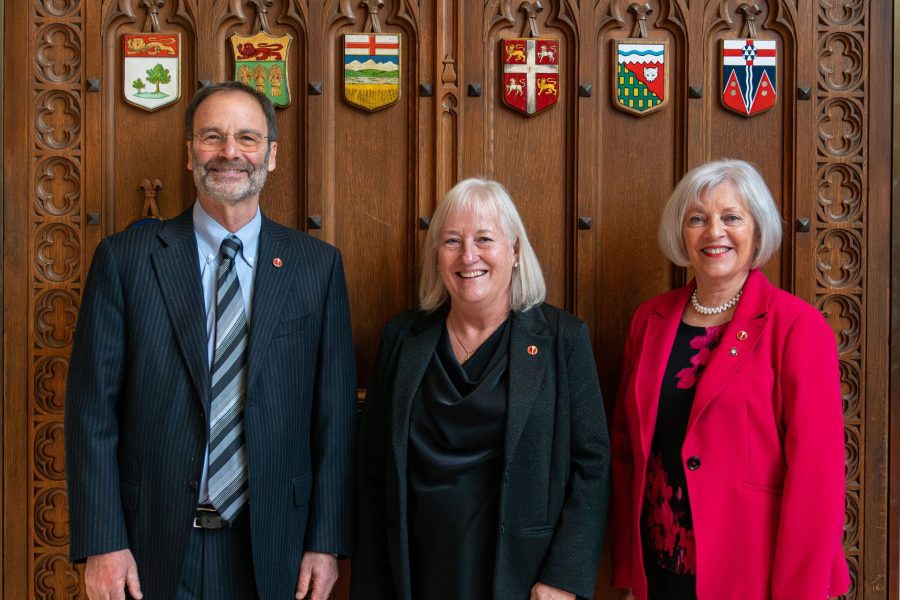 Senator Marc Gold (left) stands with Senator Joan Kingston (centre) and Senator Nancy Hartling (right). (Photo: Senate of Canada)